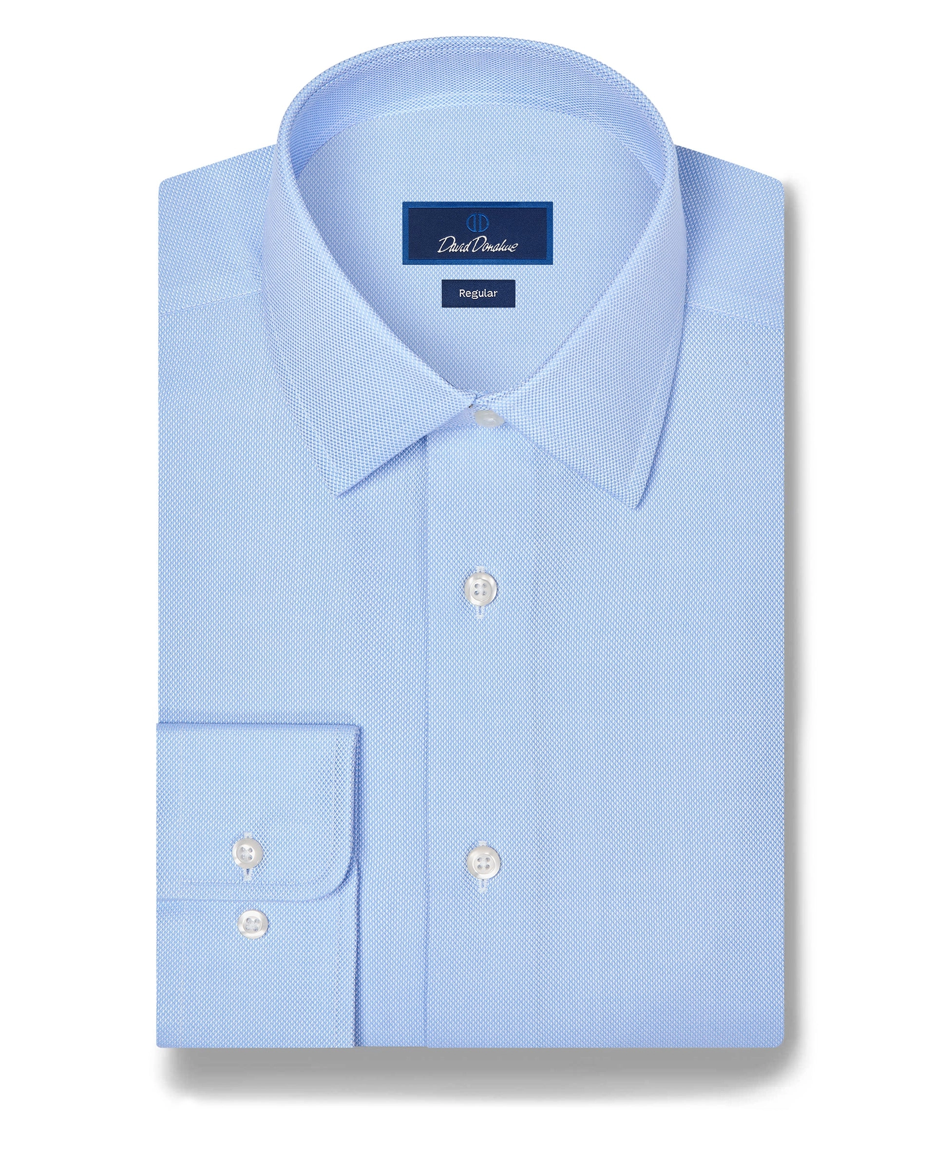 A sky blue dress shirt laid flat