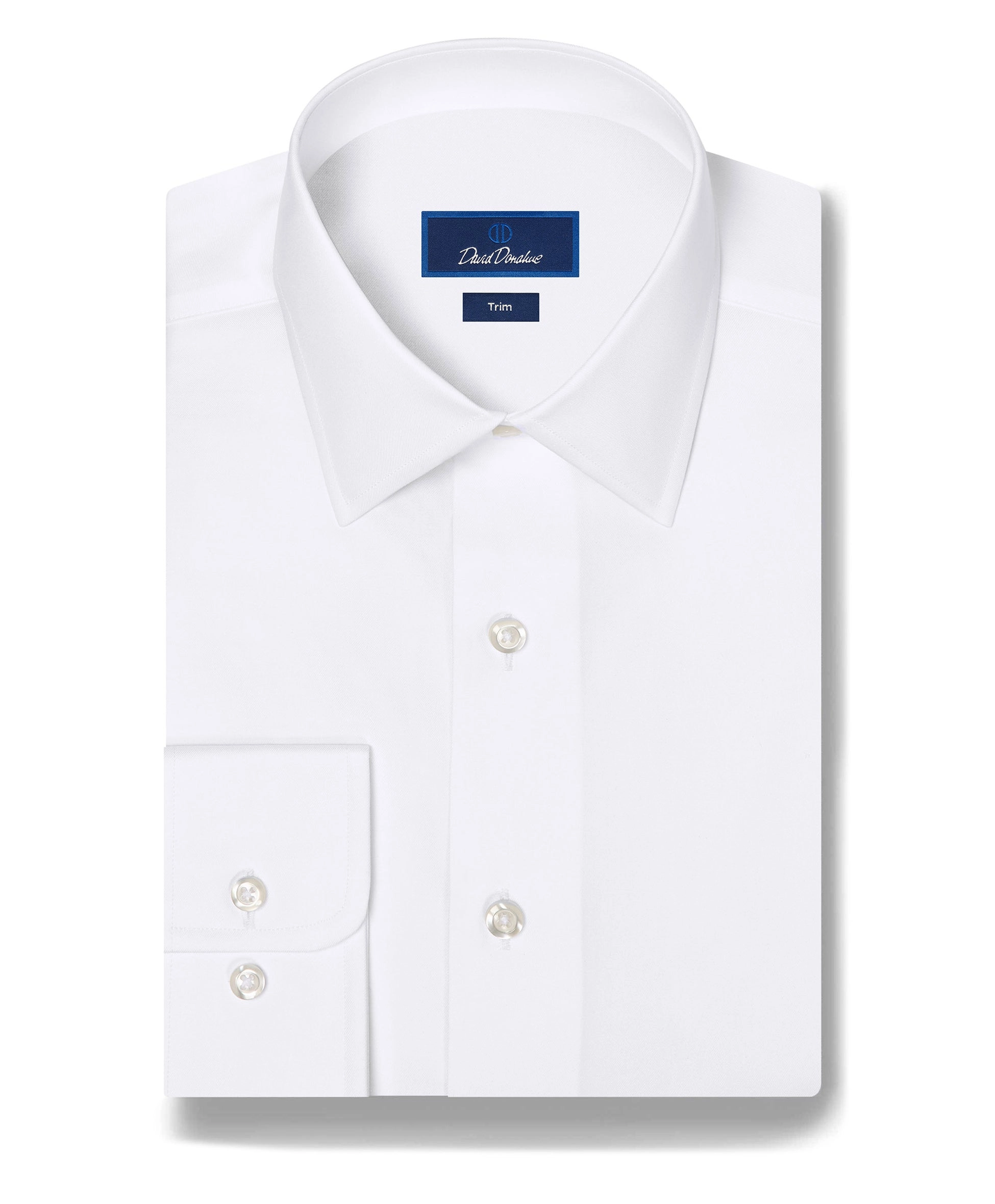 A white trim fit dress shirt laid flat