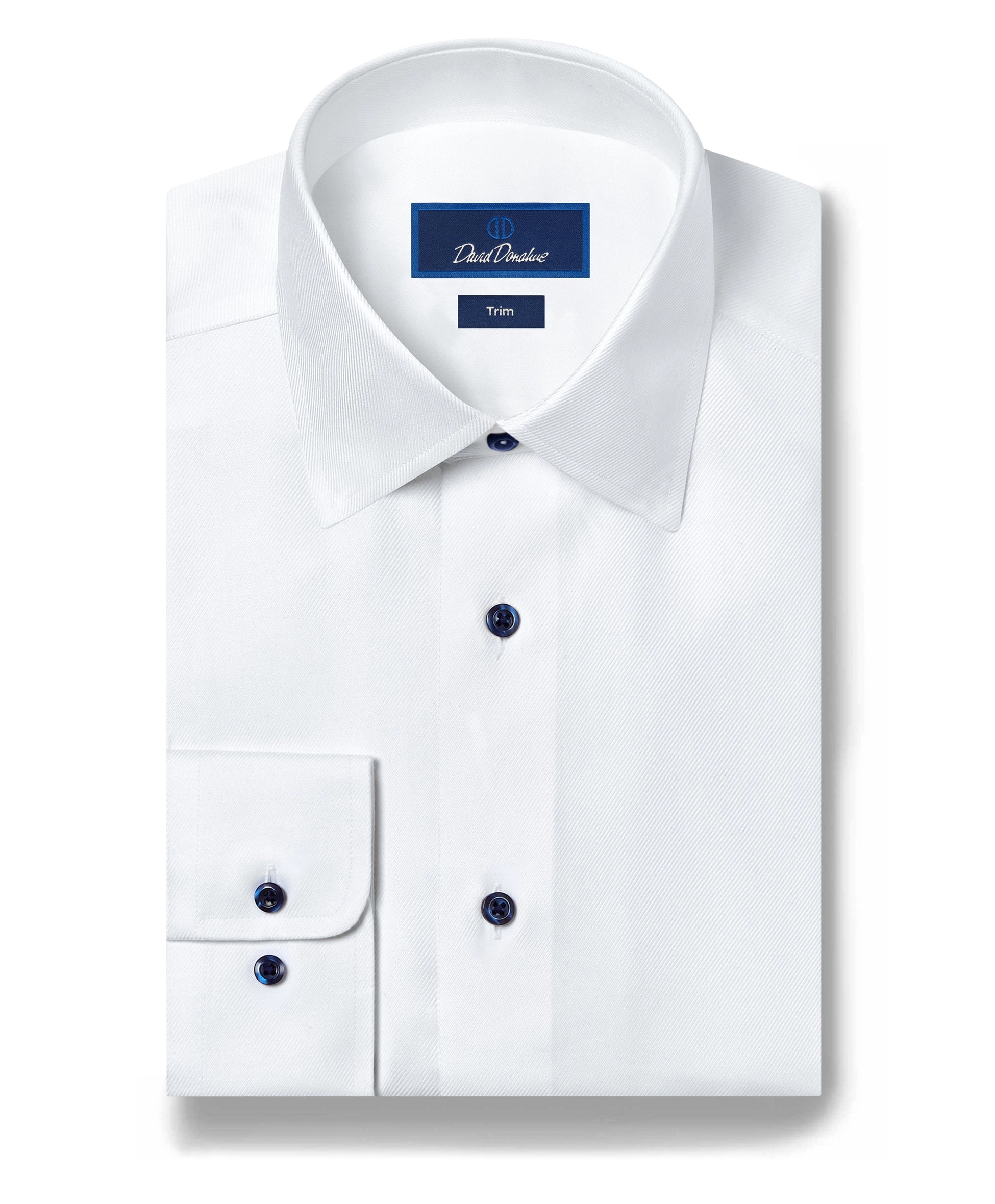 A white dress shirt with navy buttons laid flat