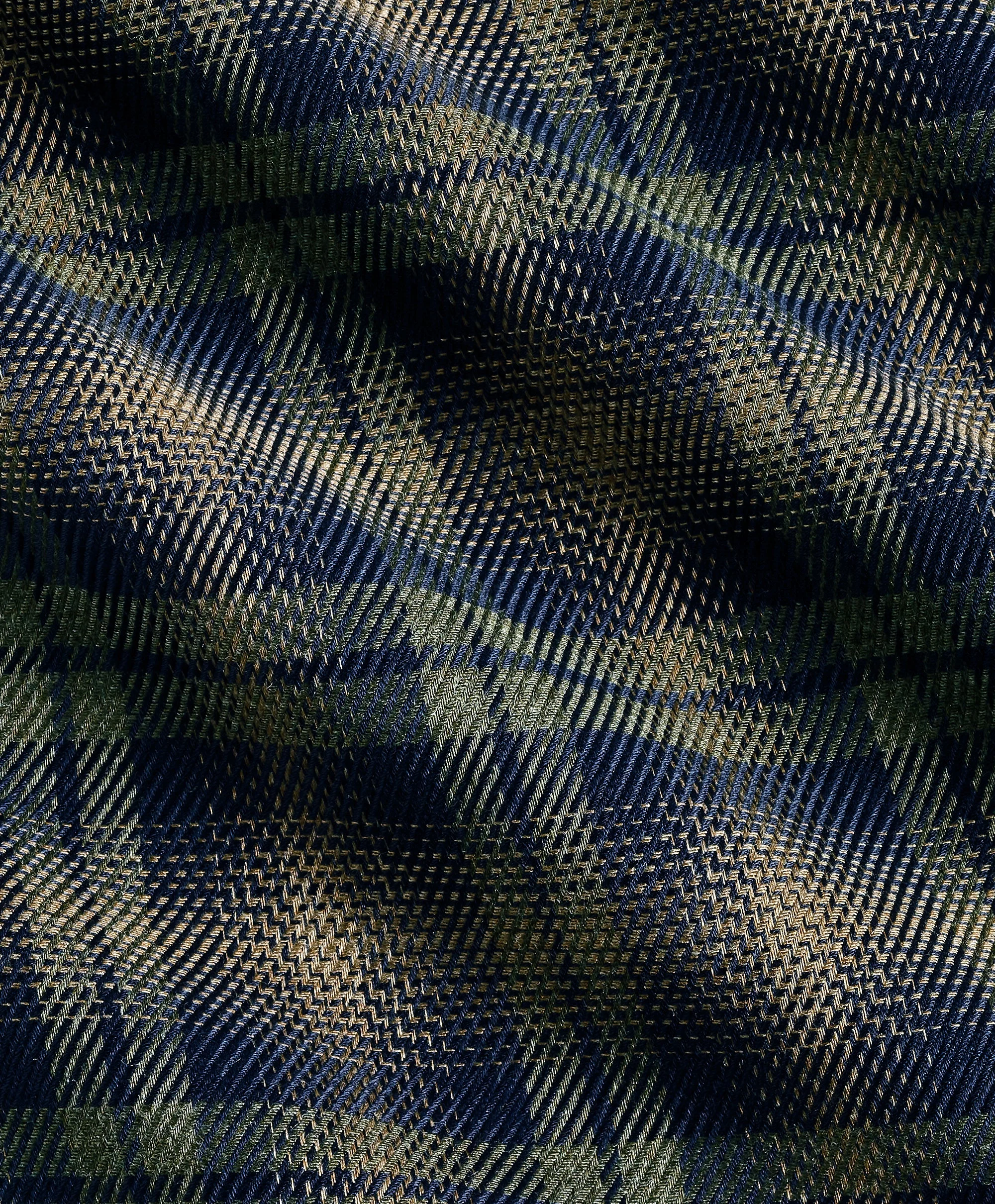 Close view of a dark green and navy plaid wool cloth