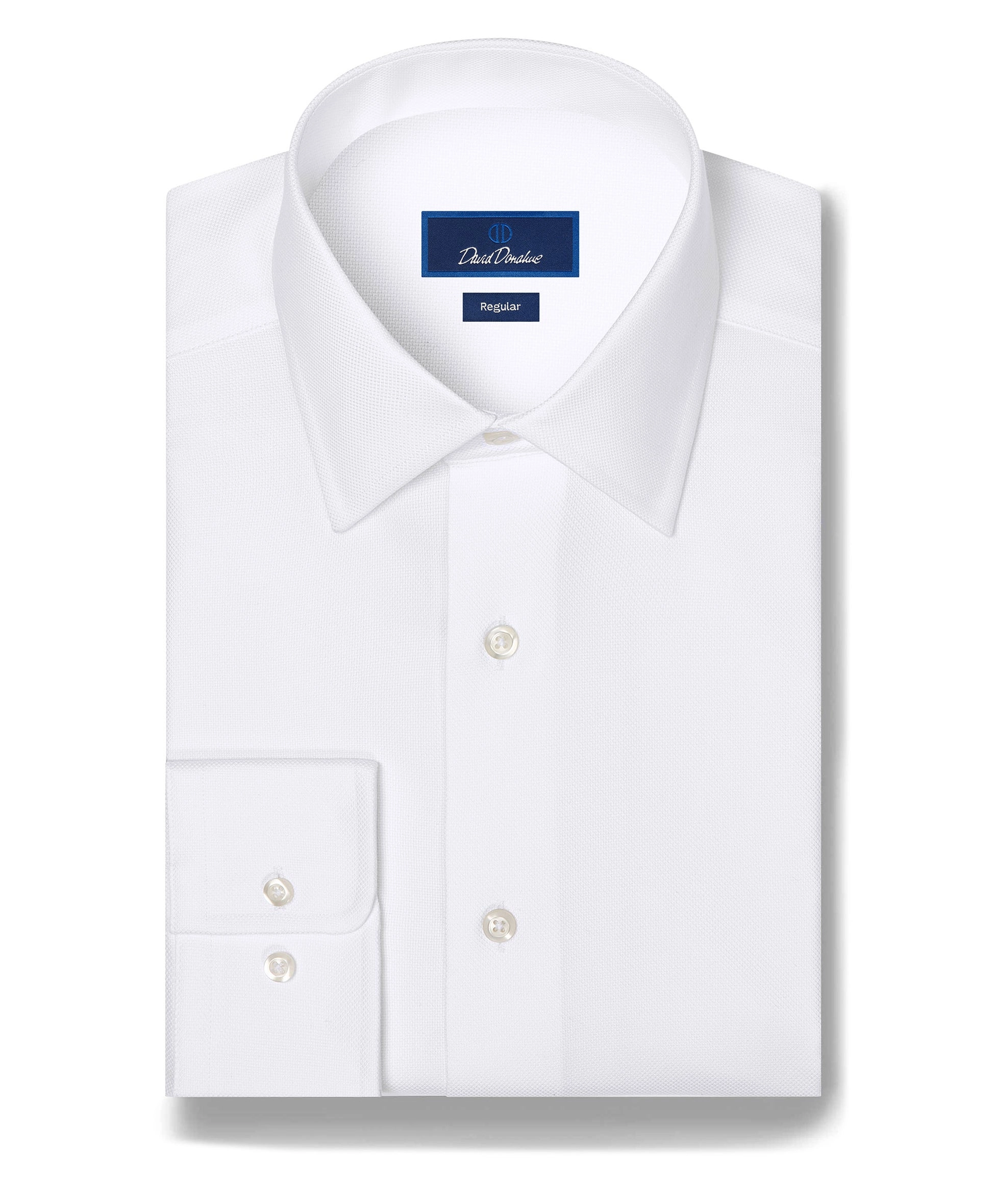 A white button-down dress shirt laid flat